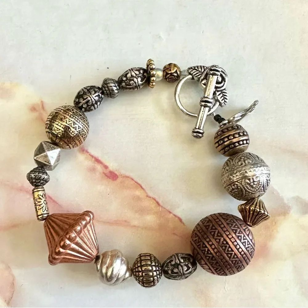 Silver/gold/rose tone bracelet with breast cancer awareness charm